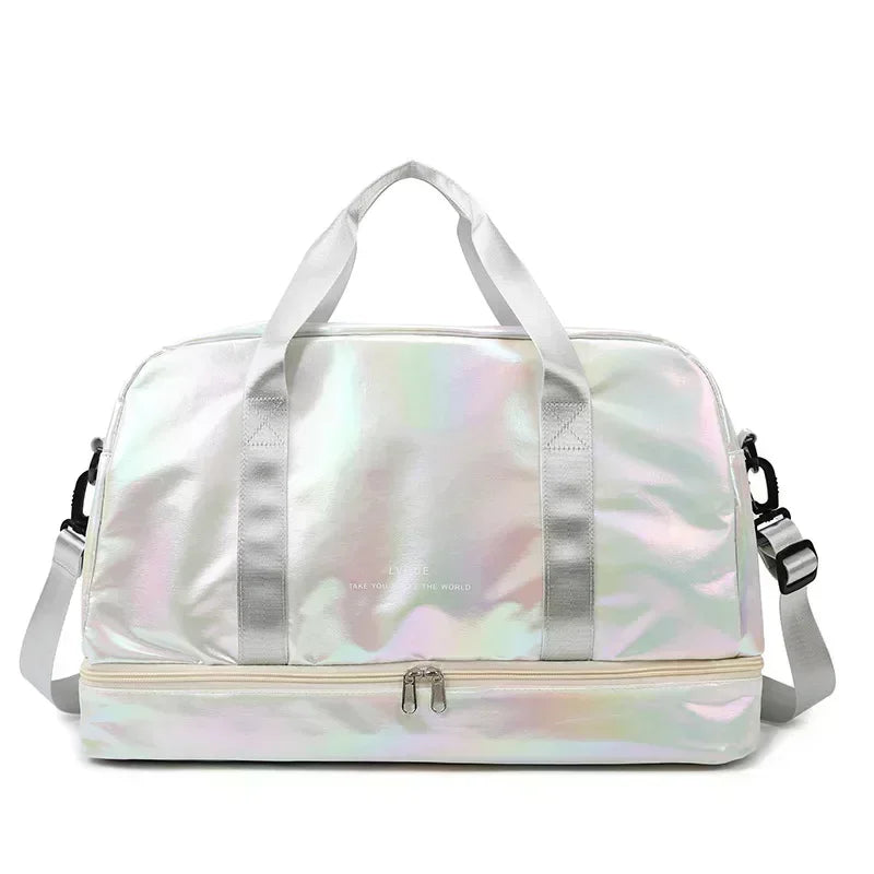 A silver iridescent travel duffel bag with light pink trim and handles.
