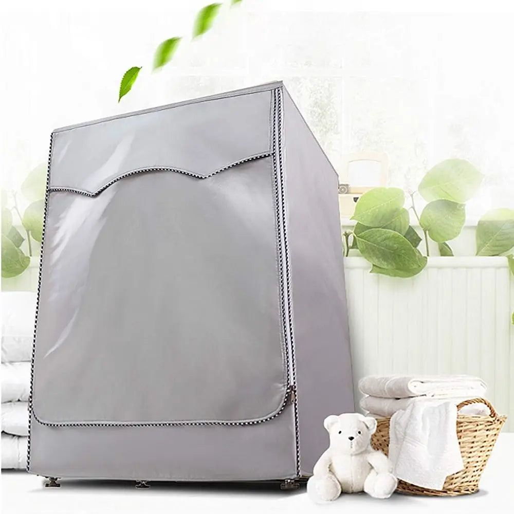 A gray waterproof washing machine cover with a roll edge design is shown next to a stack of white towels and a woven basket.
