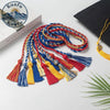 A bundle of multi-colored graduation honor cords with tassels featuring double fringe trim for ceremonies and crafts.