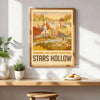 A framed canvas art print depicting a scenic autumn landscape with buildings and trees.