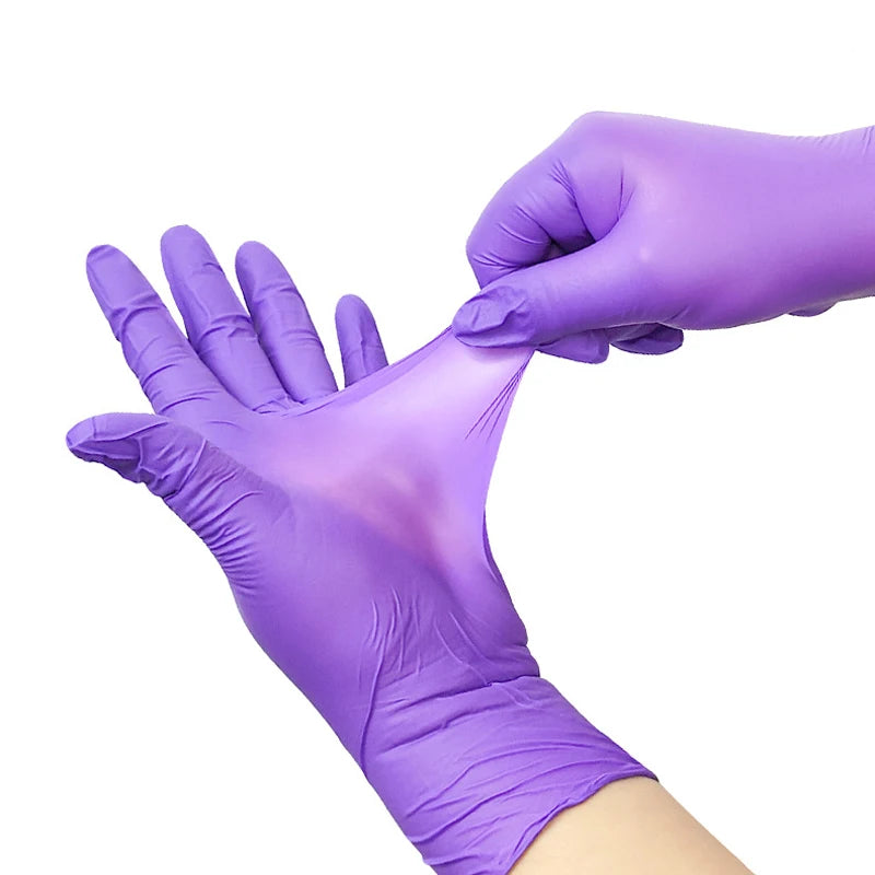 A hand wearing a purple disposable nitrile glove is picking up another finger.