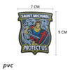 A dark blue St. Michael angel patch featuring a warrior figure and the text Protect Us