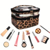 A leopard print transparent double-layer makeup bag with various cosmetic items inside.