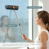 A woman is using a 3-in-1 adjustable scrub brush with a smooth silicone wiper and V-shaped brush to clean a window.