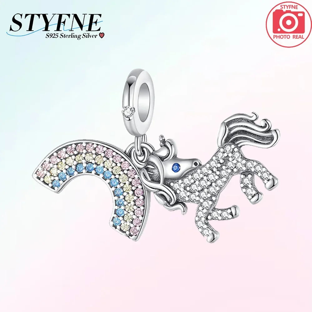 Silver unicorn and pegasus charm with rainbow crystals on a silver chain.