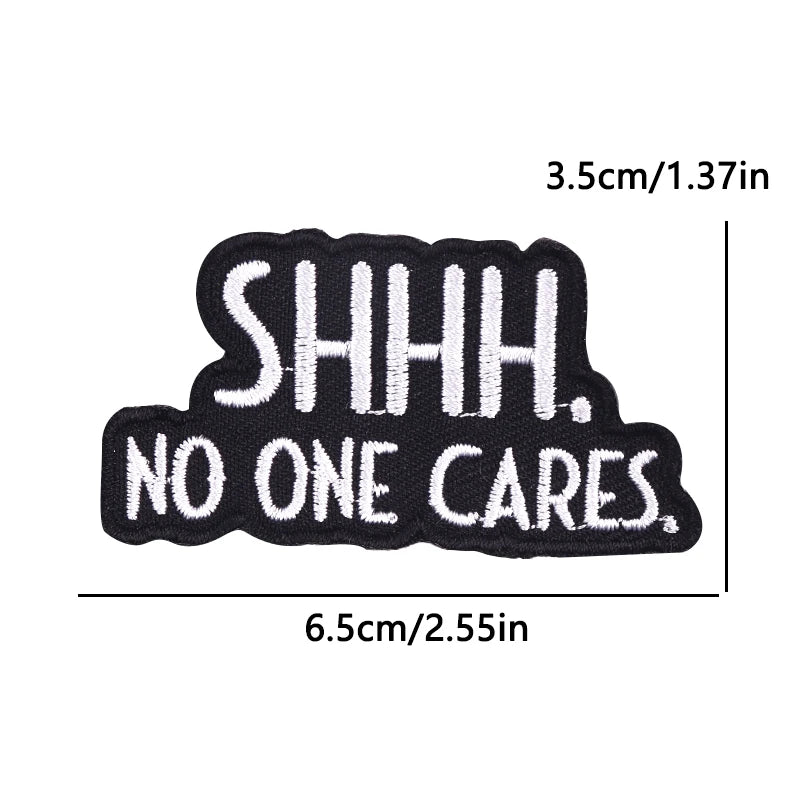 Black embroidered iron-on patch with the text SHHH. NO ONE CARES.
