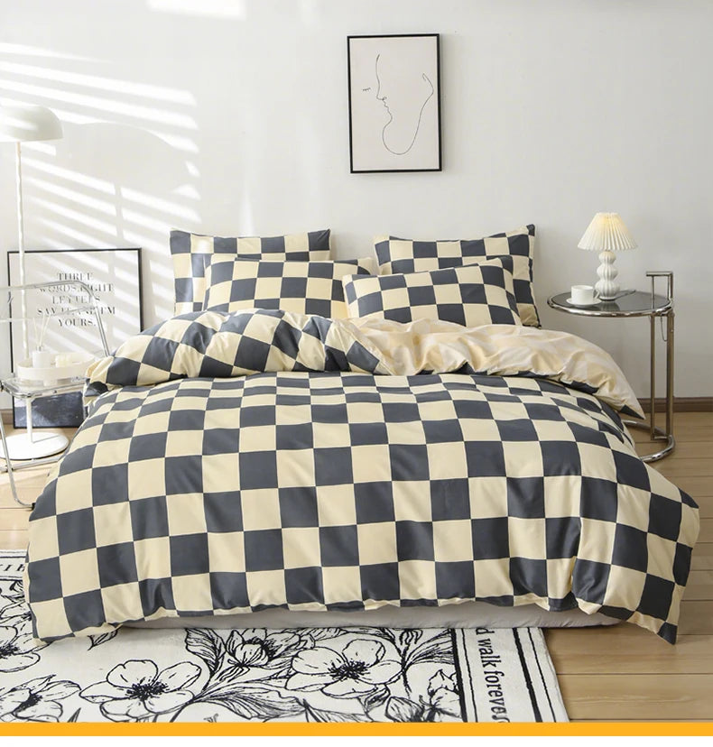 A checkered print bedding set featuring a duvet cover and pillowcases in black and beige tones.