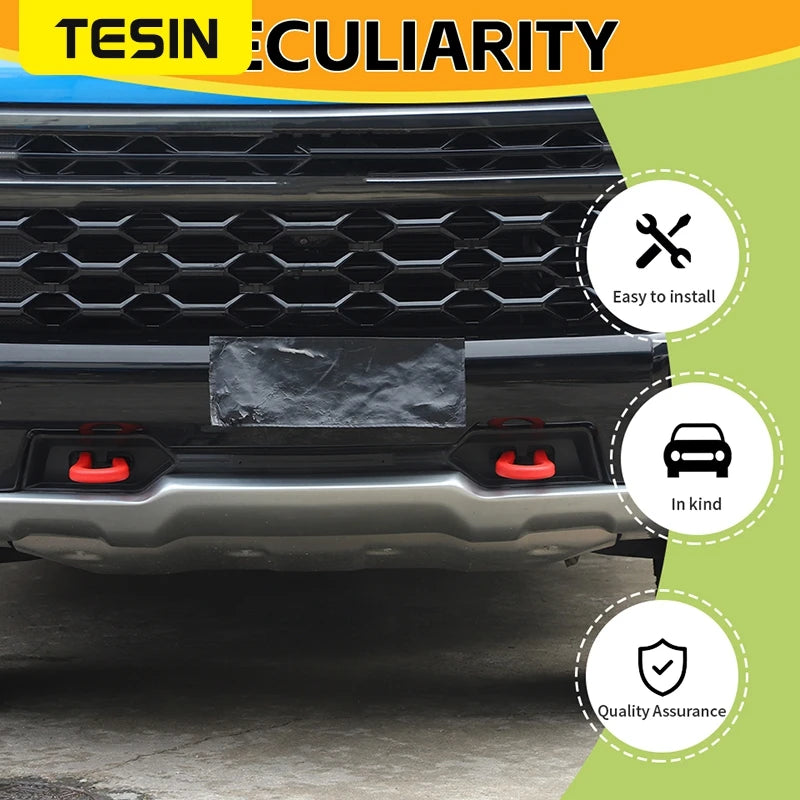 Black front bumper tow hook cover for Chevrolet Silverado and GMC Sierra vehicle.