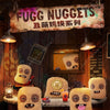 A display of Fugg Nuggets plush toys, featuring several monster-like characters hanging in a rustic wooden setting.
