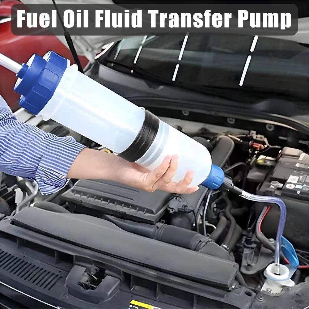 A hand is holding a white fuel oil fluid transfer pump connected to an engine component.
