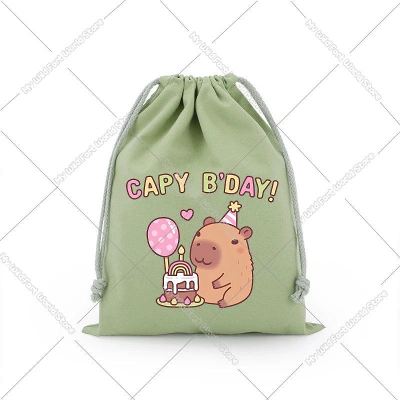 A light green drawstring storage bag featuring a cute capybara illustration celebrating birthday.