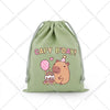 A light green drawstring storage bag featuring a cute capybara illustration celebrating birthday.