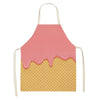A pink dripping linen kitchen apron with a yellow waffle texture.