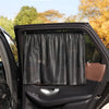 A black car window is covered with a black sunshade inside the vehicle.
