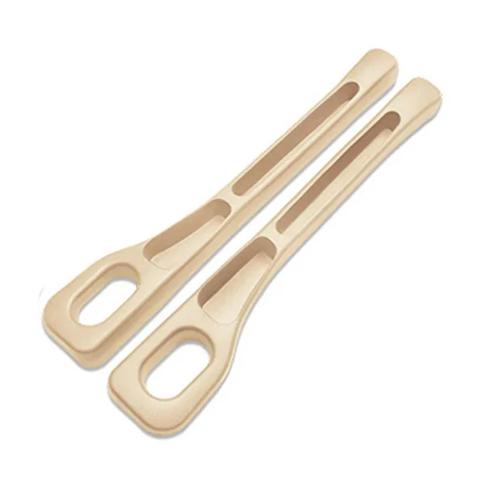 A pair of light beige universal car seat gap filler and storage organizer tools.
