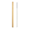 A tall, gold-colored reusable stainless steel drinking straw with an attached cleaning brush.