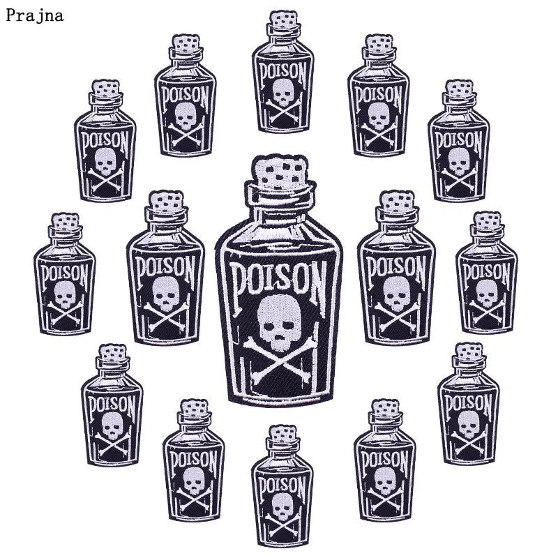 A set of ten black glass bottles with poison labels featuring skull and crossbones designs.