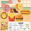 Kit de peinture DIY pour enfants avec moules, peinture et pinceaux, accompagnés d'articles à thème alimentaire.