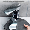 A hand holds a dark cleaning cloth wiping a shiny stainless steel porcelain item.