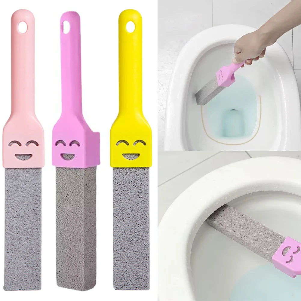 A set of three colored pumice stone toilet and bathroom cleaning brushes with handles in pink, purple, and yellow.