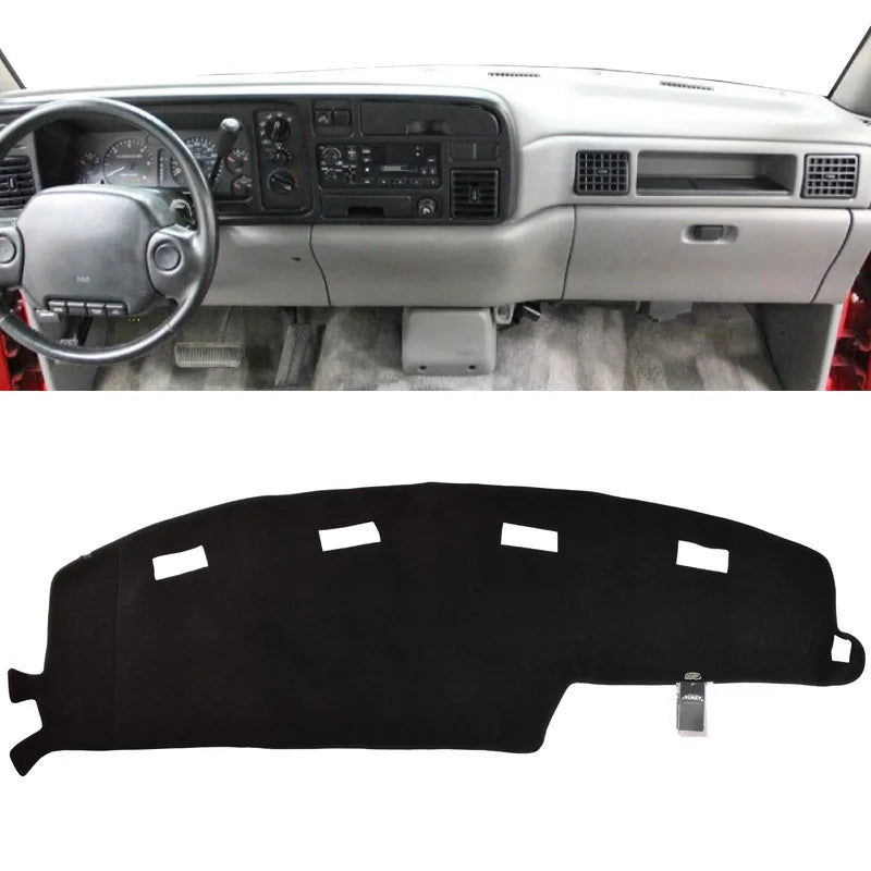 Black custom-fit dash cover for a Dodge Ram truck interior.