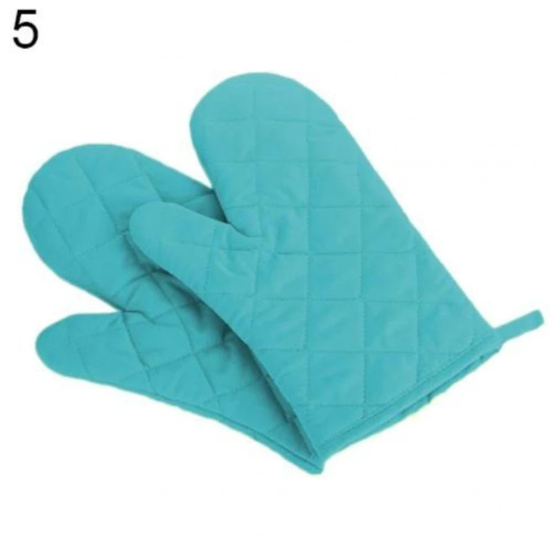 Light blue quilted heat-resistant oven mitts shown from the palm side.