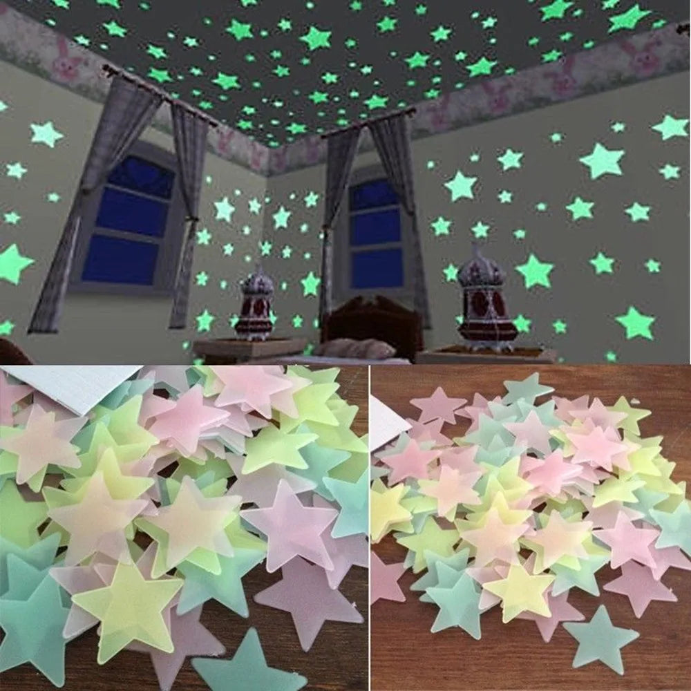 A collection of glow-in-the-dark star wall stickers in various pastel colors scattered on a wooden surface.