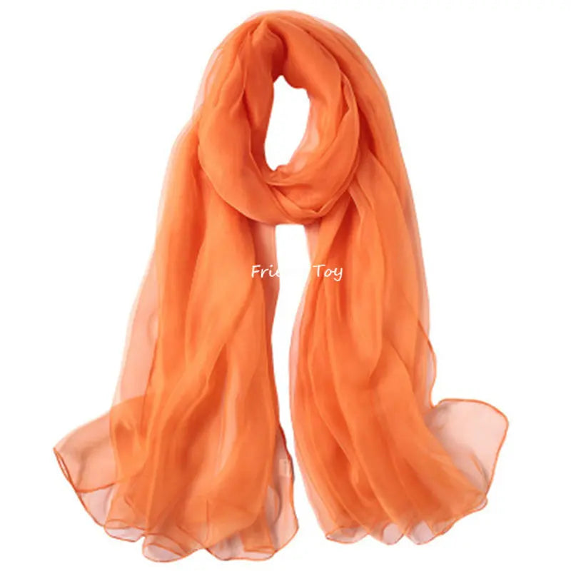 Orange sheer fabric scarf or wrap for imaginative play