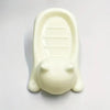 A white cat-shaped soap dish with a drainage tray.