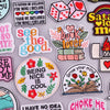 A collection of colorful embroidered iron-on patches featuring inspirational phrases and designs.