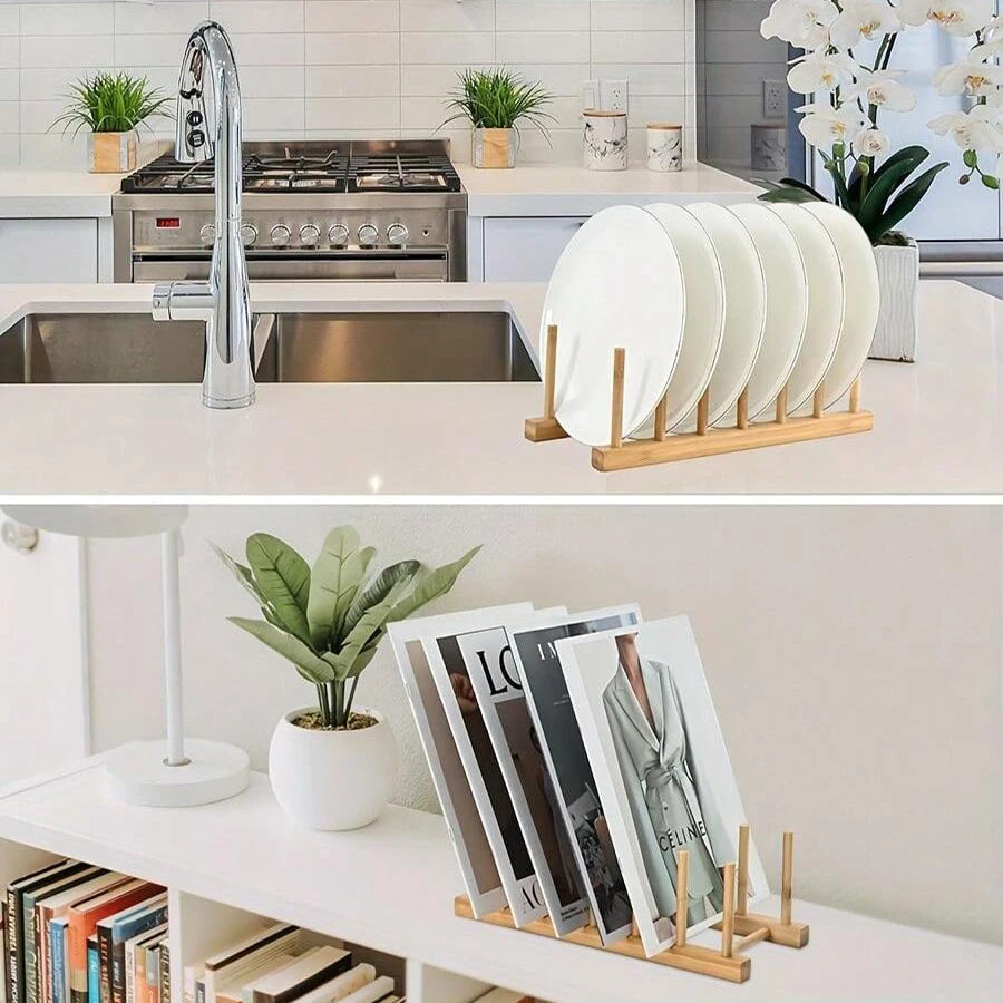 A wooden bamboo dish drying rack holding several white plates on a kitchen counter.