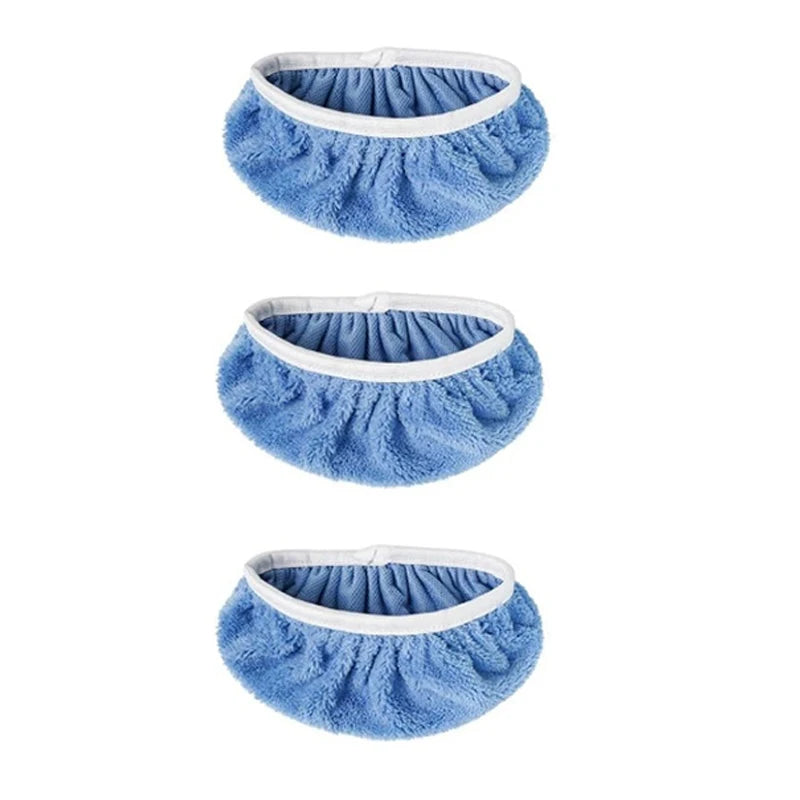 Three blue fuzzy reusable mop pads with white trim shown from above