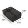 A black velvet jewelry gift box with a bow, shown from above and displaying its dimensions.