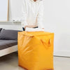 A bright yellow waterproof moving and storage bag is shown on the floor.