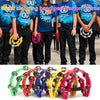 A collection of half-moon tambourines with double rows of metal jingles in various colors.
