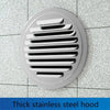 A round stainless steel hood with horizontal slats for ventilation mounted on a tiled surface.