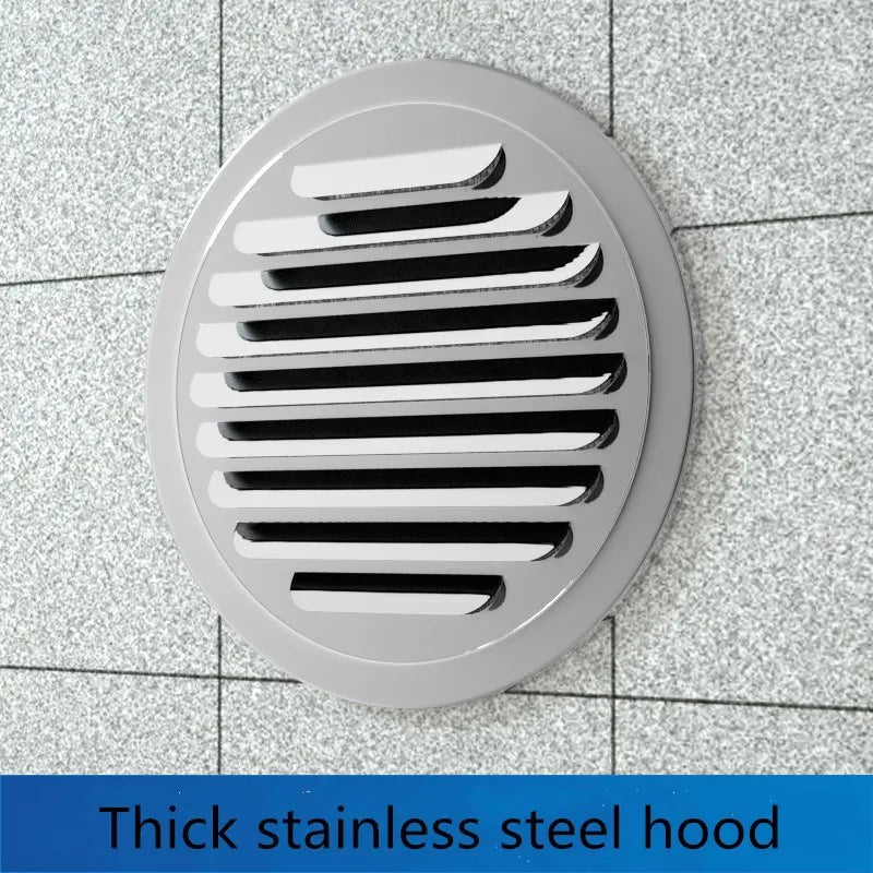 A round stainless steel hood with horizontal slats for ventilation mounted on a tiled surface.
