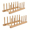 A wooden dish drying rack made of bamboo with multiple vertical rods for drying dishes.