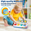 A toddler plays with a colorful pop-up dinosaur toy designed for sensory learning and fine motor skills.