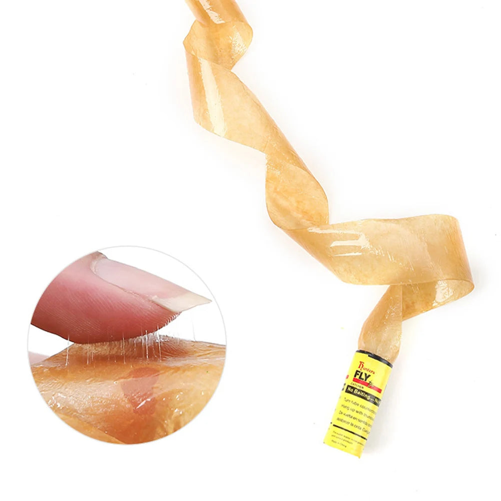 A close-up of a disposable sticky fly trap, showing its amber color and twisted form.