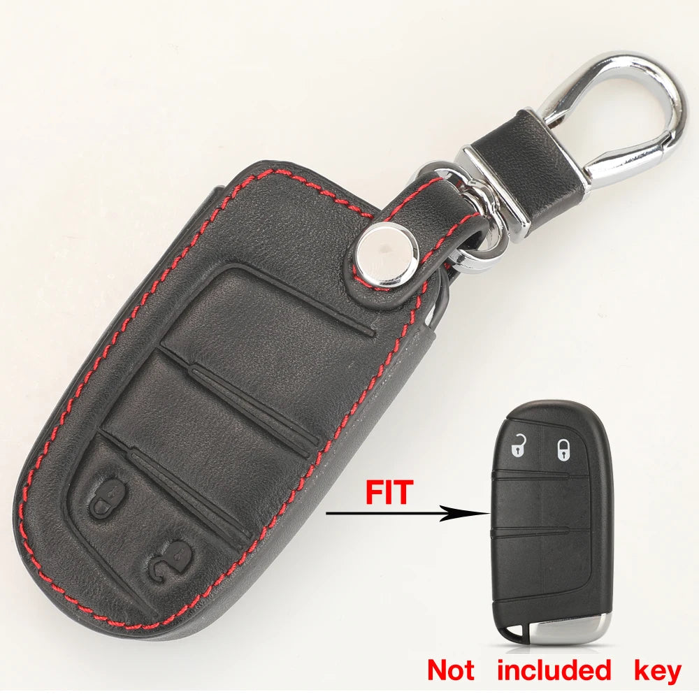 A black leather replacement key fob shell with a silver split ring attached, shown next to the actual key.