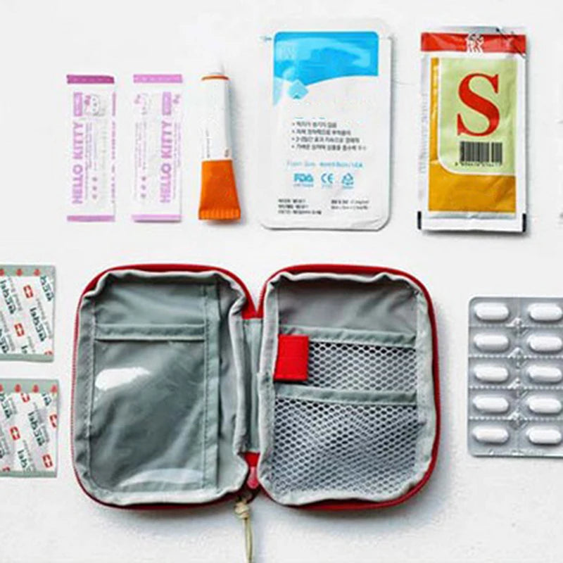 A compact travel medicine organizer bag is shown open, displaying various medical supplies and a blister pack of medication.