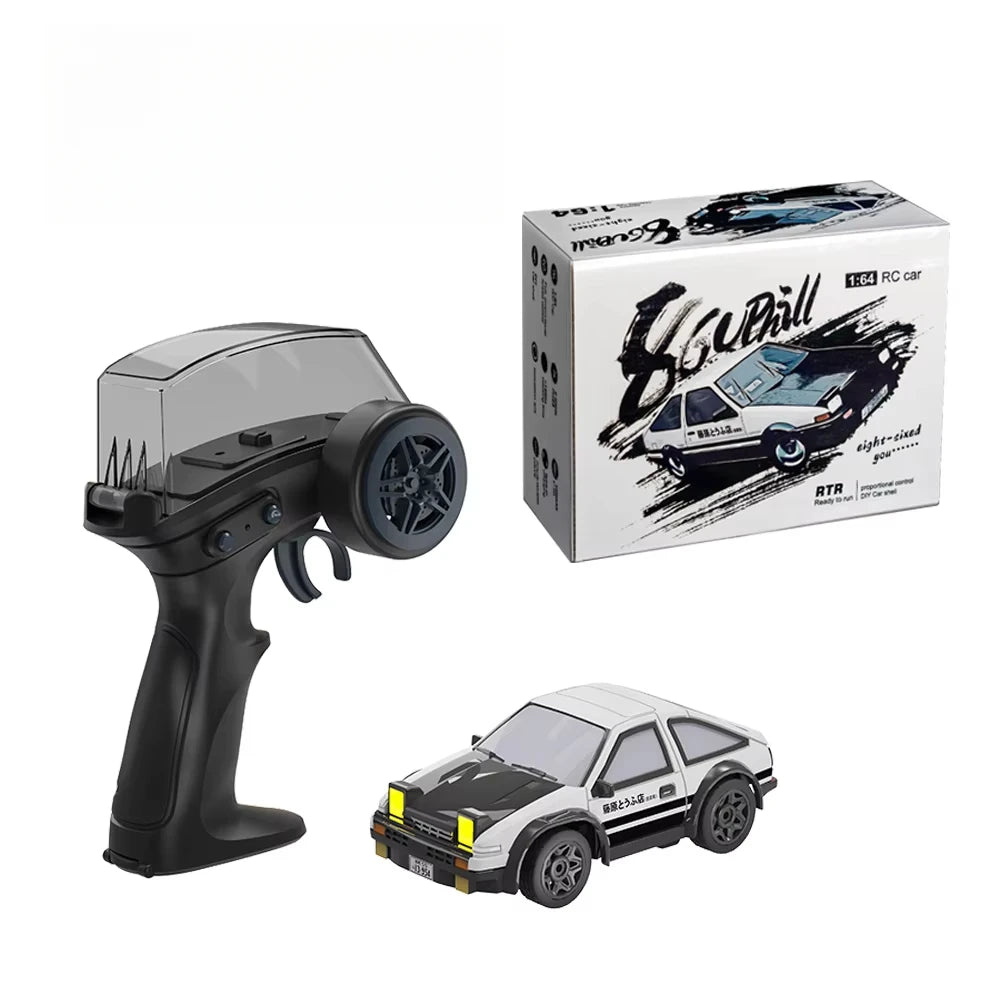 A boxed compact 1/64 scale 4WD RC drift car with a finished model of the car.