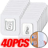 A set of 40 clear, invisible adhesive wall hooks in various sizes stacked together.