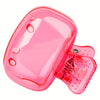 A pink portable toothbrush head cover with a clip attached.