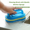 A hand is holding a blue and yellow kitchen sponge cleaning brush with an ergonomic handle on a countertop.