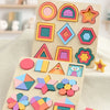 A wooden rainbow shape puzzle featuring colorful geometric pieces arranged in various patterns.