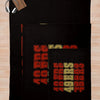 A black knit throw blanket featuring a repeating pattern of red and yellow letters.
