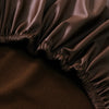 Close-up of a dark brown waterproof PU stretch bench cover with an elastic edge.