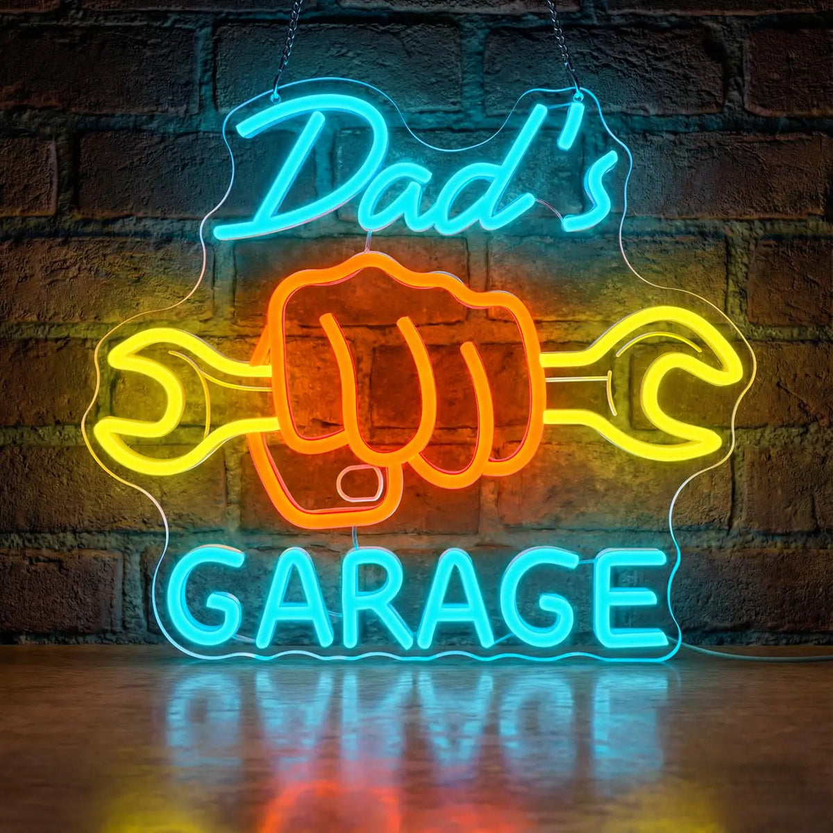 Blue neon sign shaped like a hand and wrench spelling out Dad's Garage on a brick wall.